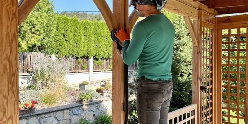 renovation-wooden-gazebo-man-work-wood-sanding-wood-renovation